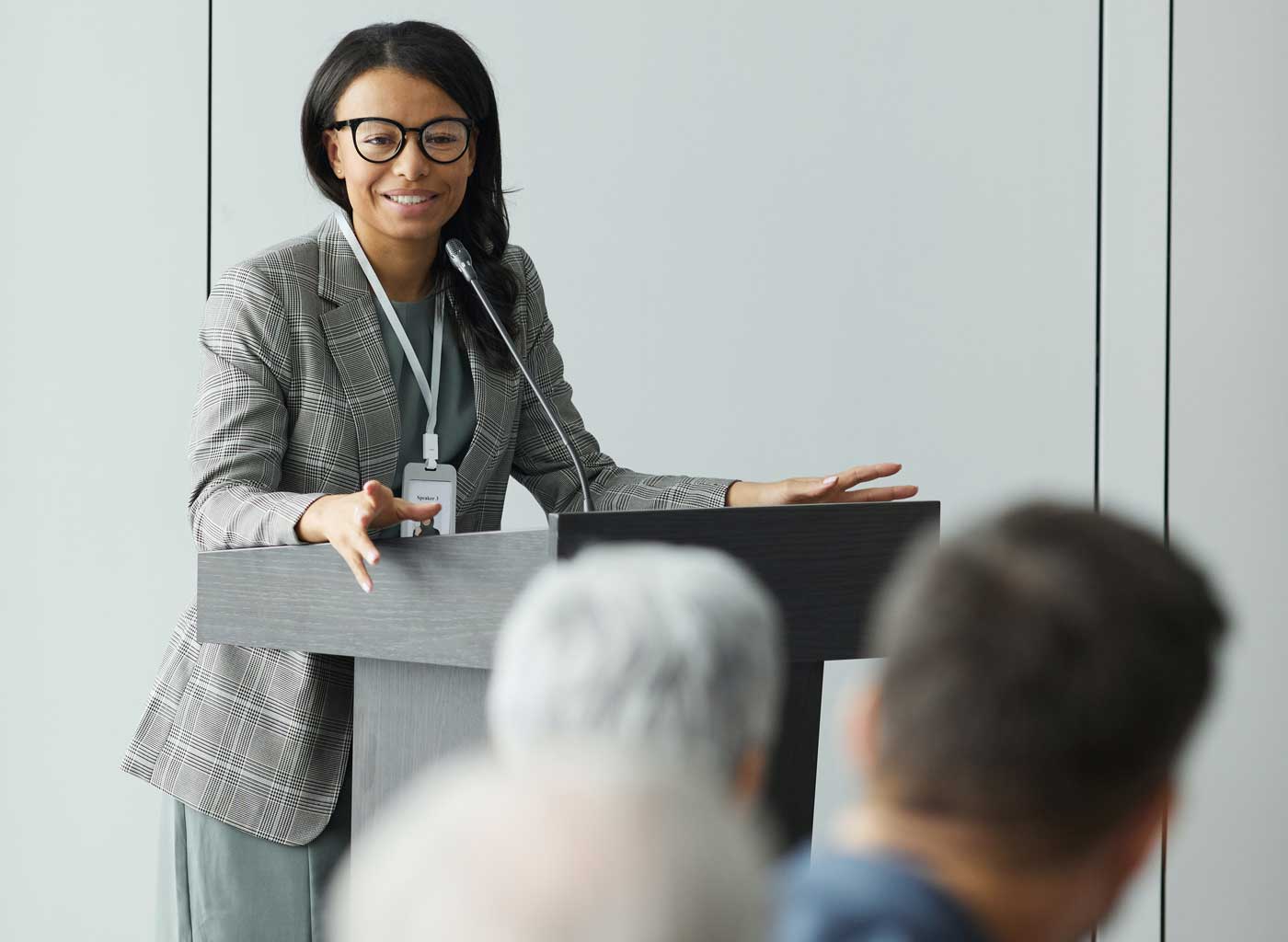 Woman at podium delivering a speech